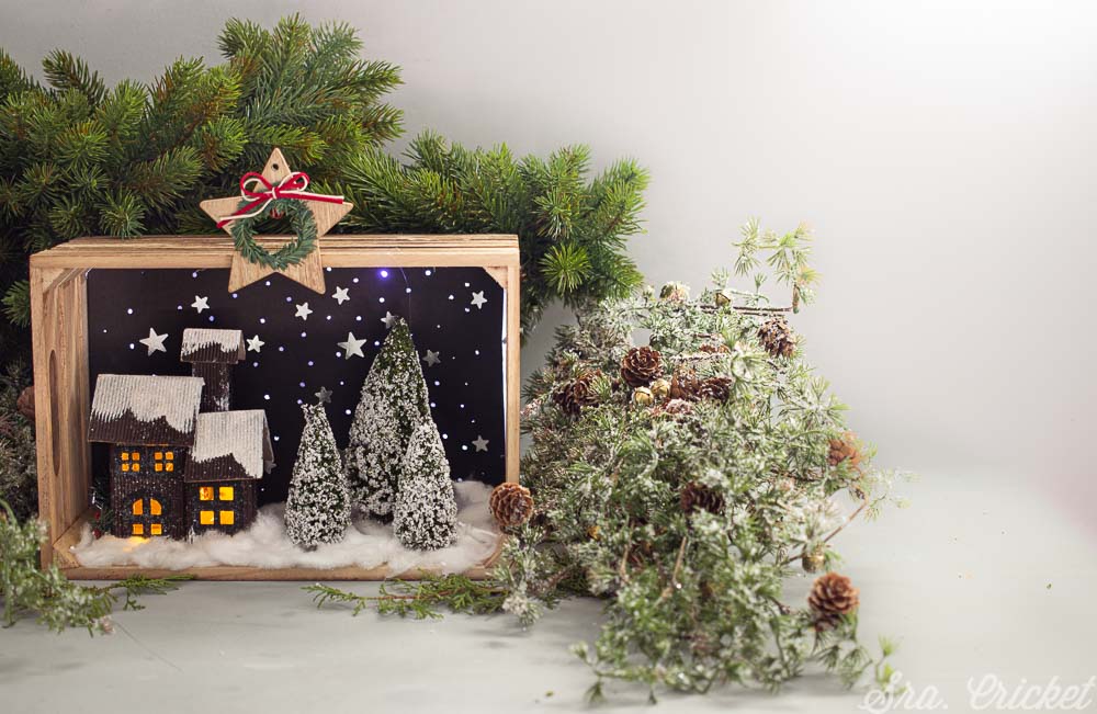 Una caja de luces con paisaje navideño. Christmas Shadow Box